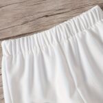 Two-piece Set for Little Girl: Black Sleeveless Top with White Patchwork and White Patchwork Shorts - Image 5