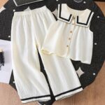 A Stylish New Collection for Girls in Spring And Summer Featuring Elegant And Versatile Designs. The Sleeveless Top Is Made from Quality Fabric with a Large Collar, Adorned with Wood Grain Buttons And Delicate Wave-Edged Ribbon Details. It Pairs Perfectly with Long Pants That Have Matching Wave-Edged Ribbon Accents, Making It a Comfortable Two-Piece Set for Casual Outings And Gatherings. an Exquisite Gift for Friends And Family, for Outdoor